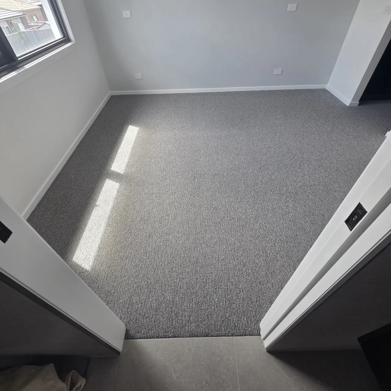 Sunlit Bedroom with Plush Carpet